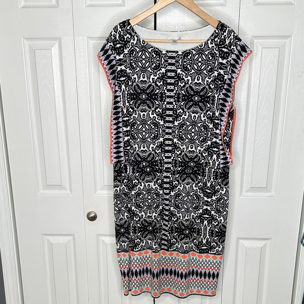 Elegant Black and White Patterned Dress with Coral Accents